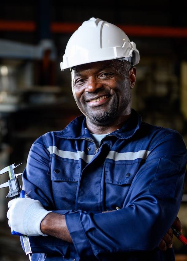 Mechanical engineer with safety hat checking and inspecting machine at repair shop at repair shop, Mechanic worker working at manufacturing factory, Machinery maintenance concept, High quality photo